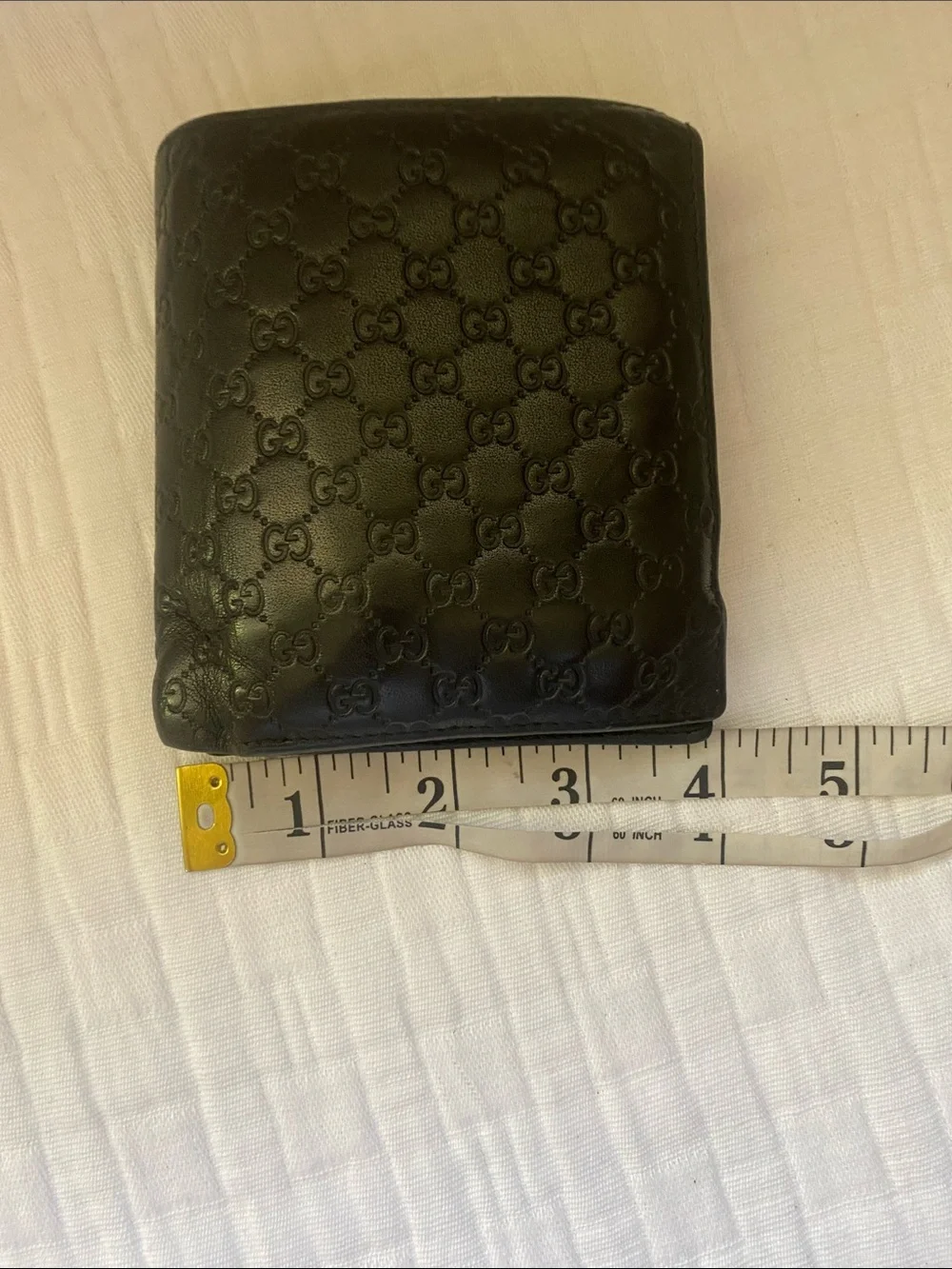 Gucci Dark Brown GG Embossed Leather Bi-Fold Wallet